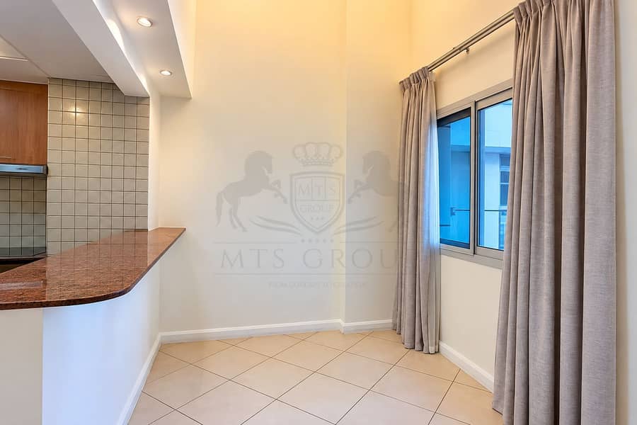 5 Modern Condo Corner with Kitchen Bar and Curtains. png