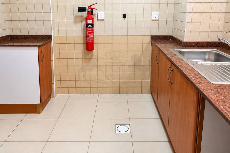 6 Clean Utility Kitchen with CO₂ Extinguisher. png