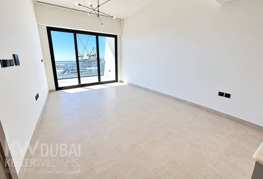 2 Sunlit Modern Room with City Cranes. png