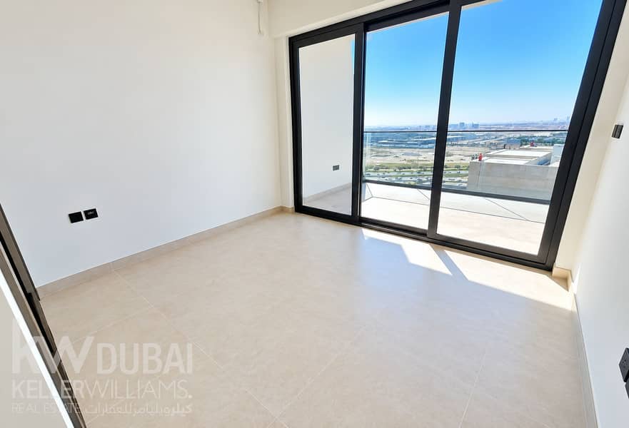 7 Sunlit Minimalist Room with City View. png