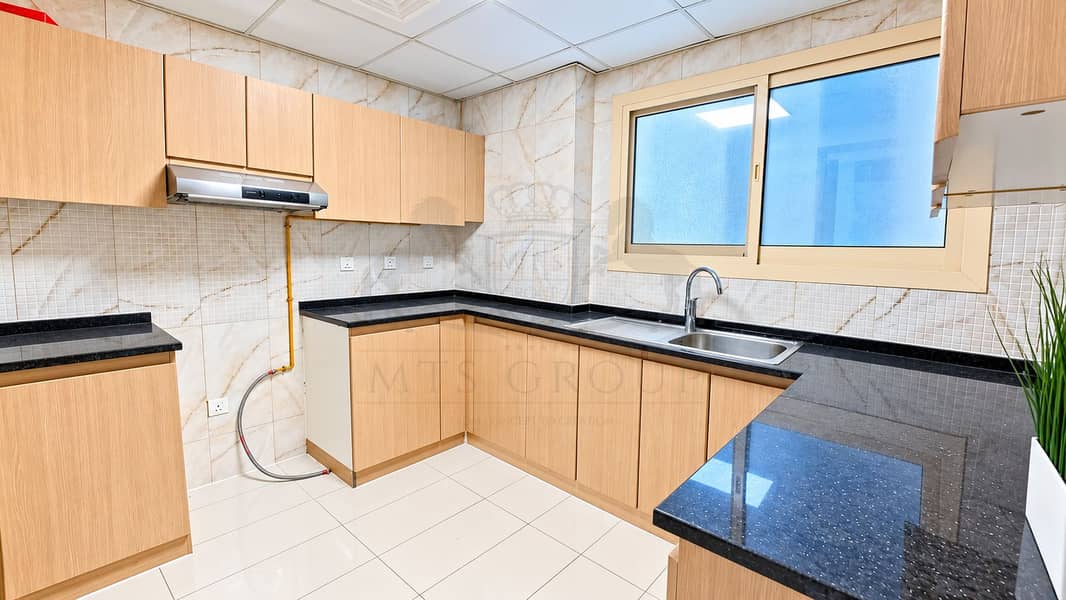 9 Modern Light-Wood Kitchen Interior. png