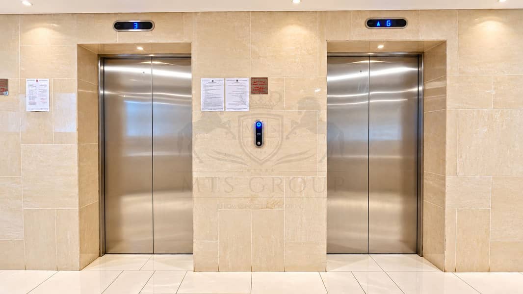13 Symmetrical Marble Elevator Lobby. png