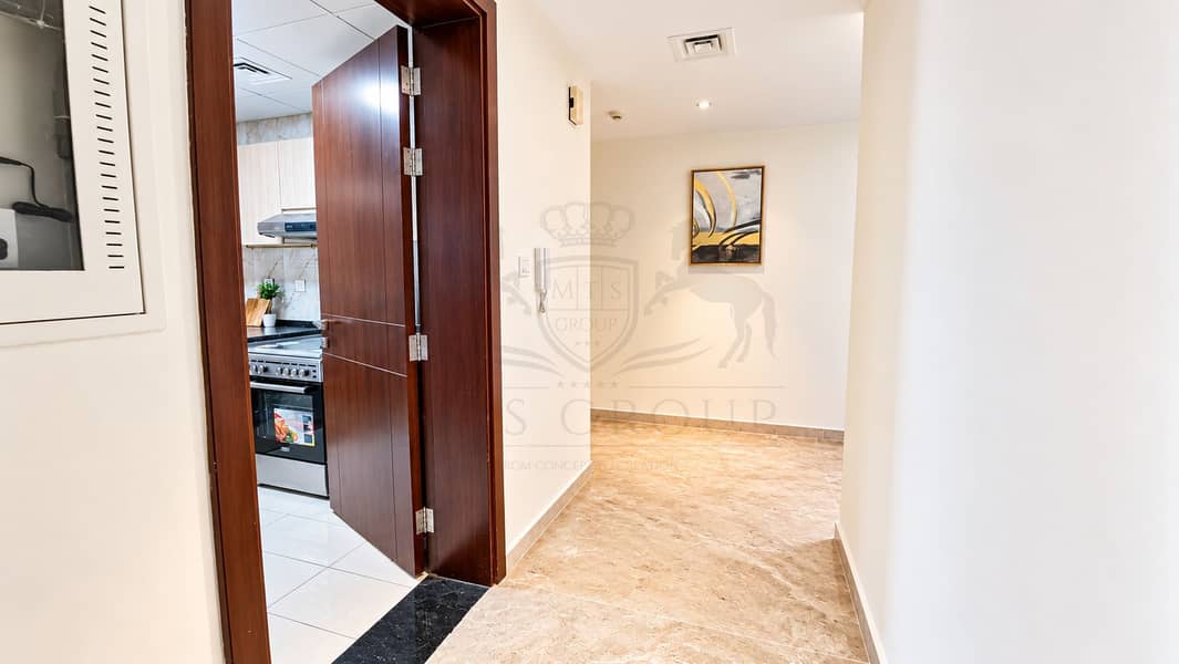 5 Modern Apartment Foyer with Kitchen View. png