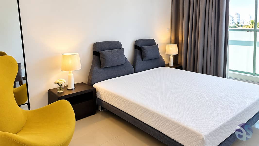 Modern Bedroom with Mustard Chair and Balcony View. png Modern Bedroom with Mustard Chair and Balcony View. png