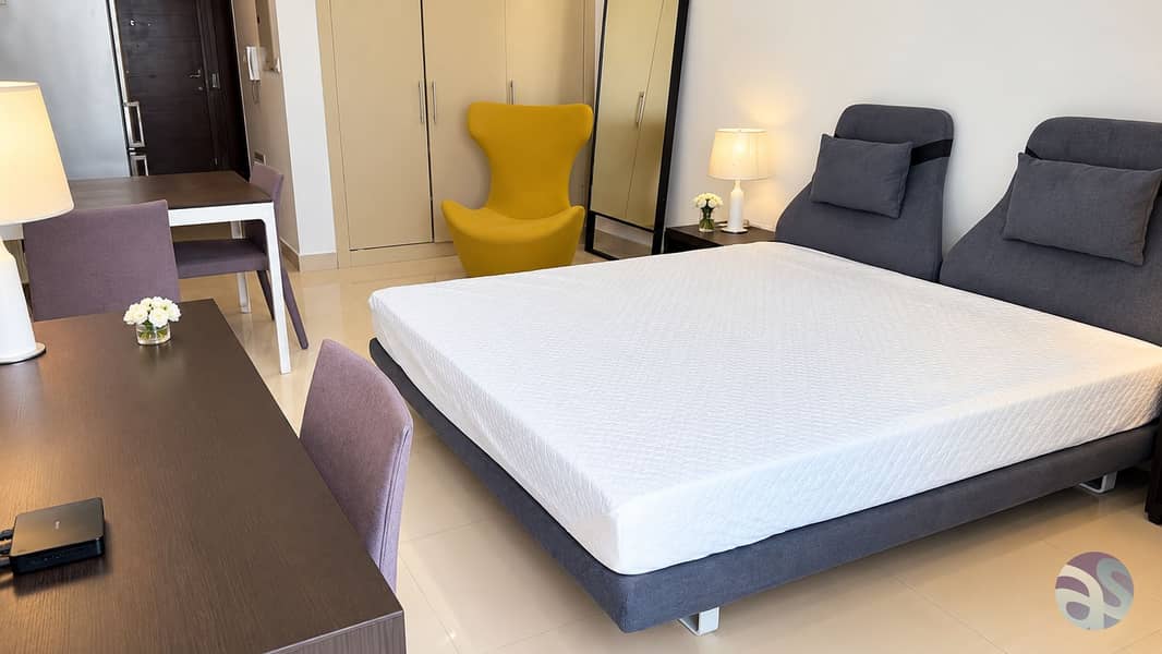 2 Modern Bedroom Studio with Yellow Accent Chair. png