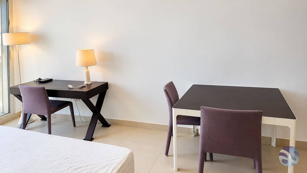 6 Minimalist Bedroom Workspace with Warm Lighting. png