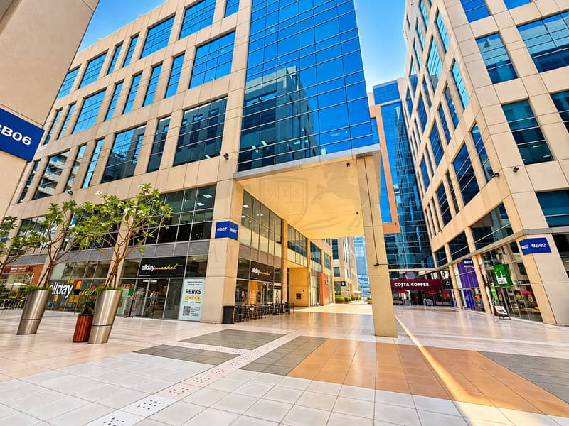 14 Sunlit Modern Office Courtyard Passage. png