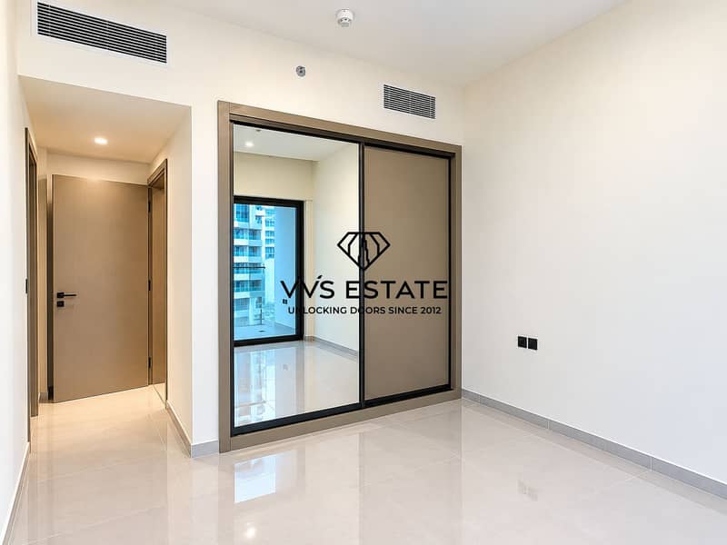 11 Modern Empty Bedroom with Mirrored Wardrobe. png