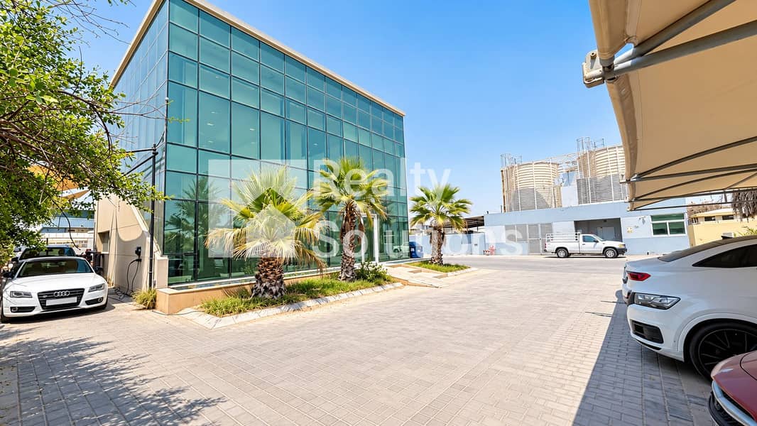14 Modern Glass Office Courtyard with Palms. png
