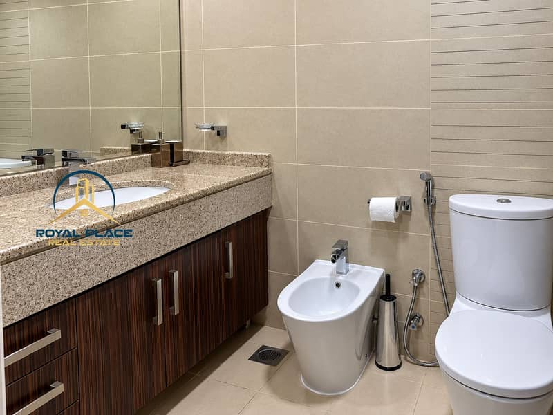 9 Modern Beige-Tiled Bathroom Vanity and Fixtures. png