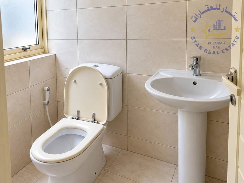 5 Clean Minimalist Tiled Bathroom. png