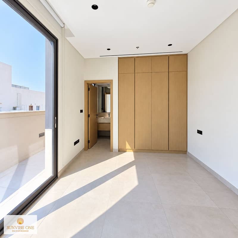 9 Sunlit Minimalist Interior with Balcony. png