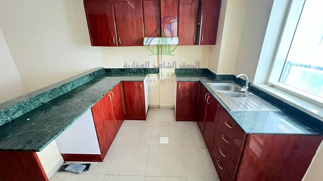 17 apartment-for-rent-3-bedroom-altaawn-alsharqh-kitchen-18. jpg