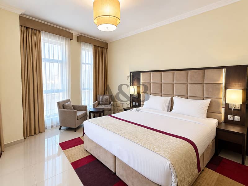 4 Elegant Burgundy-Accented Hotel Bedroom. png