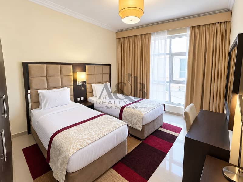 12 Modern Twin Hotel Room with Warm Lighting. png