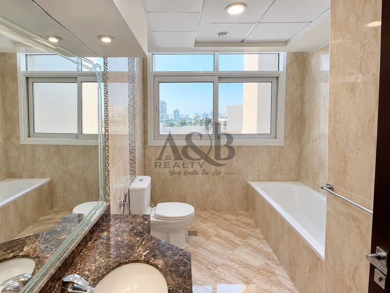 15 Modern Marble Bathroom with City View. png