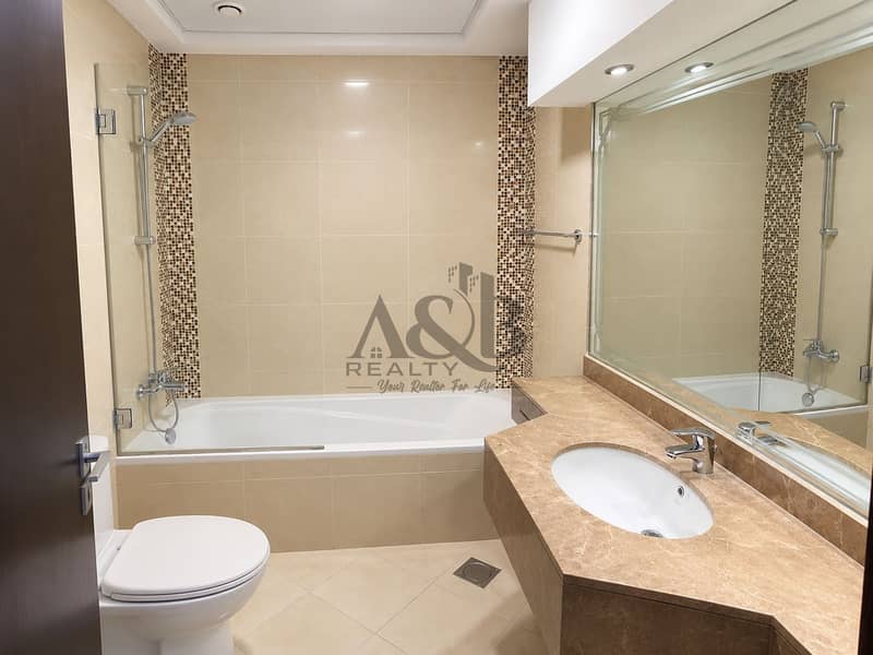 17 Modern Beige Bathroom with Mosaic Accents. png