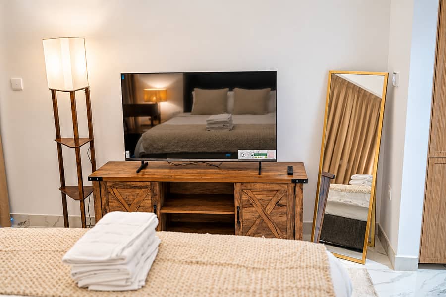 6 #14 - TV console, floor lamp, standing mirror. png
