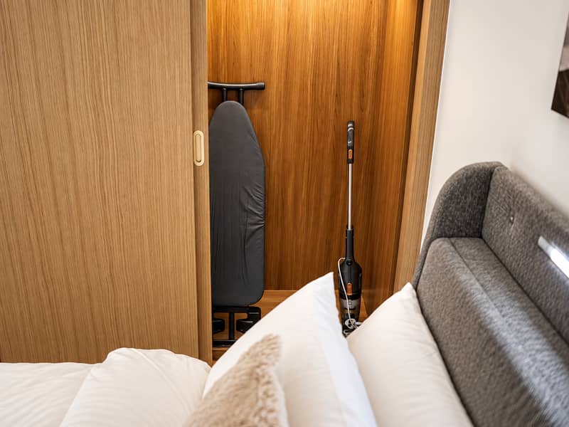 7 #3 - Wardrobe with ironing board and cordless vacuum. png