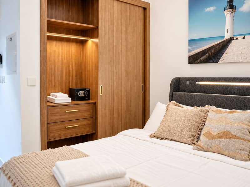 10 #12 - Wardrobe nook with in-room safe, drawers, towels. png