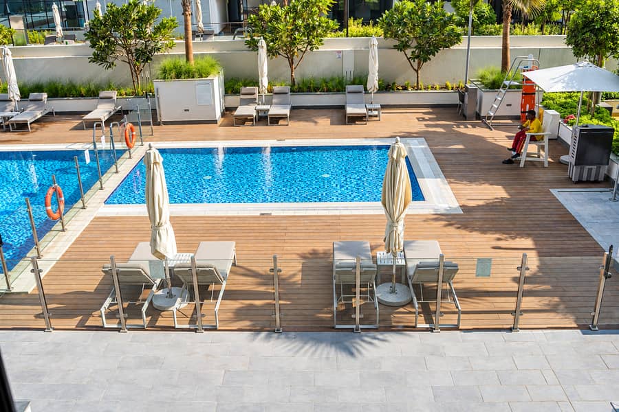 23 #16_- Pool deck with loungers and lifeguard. png