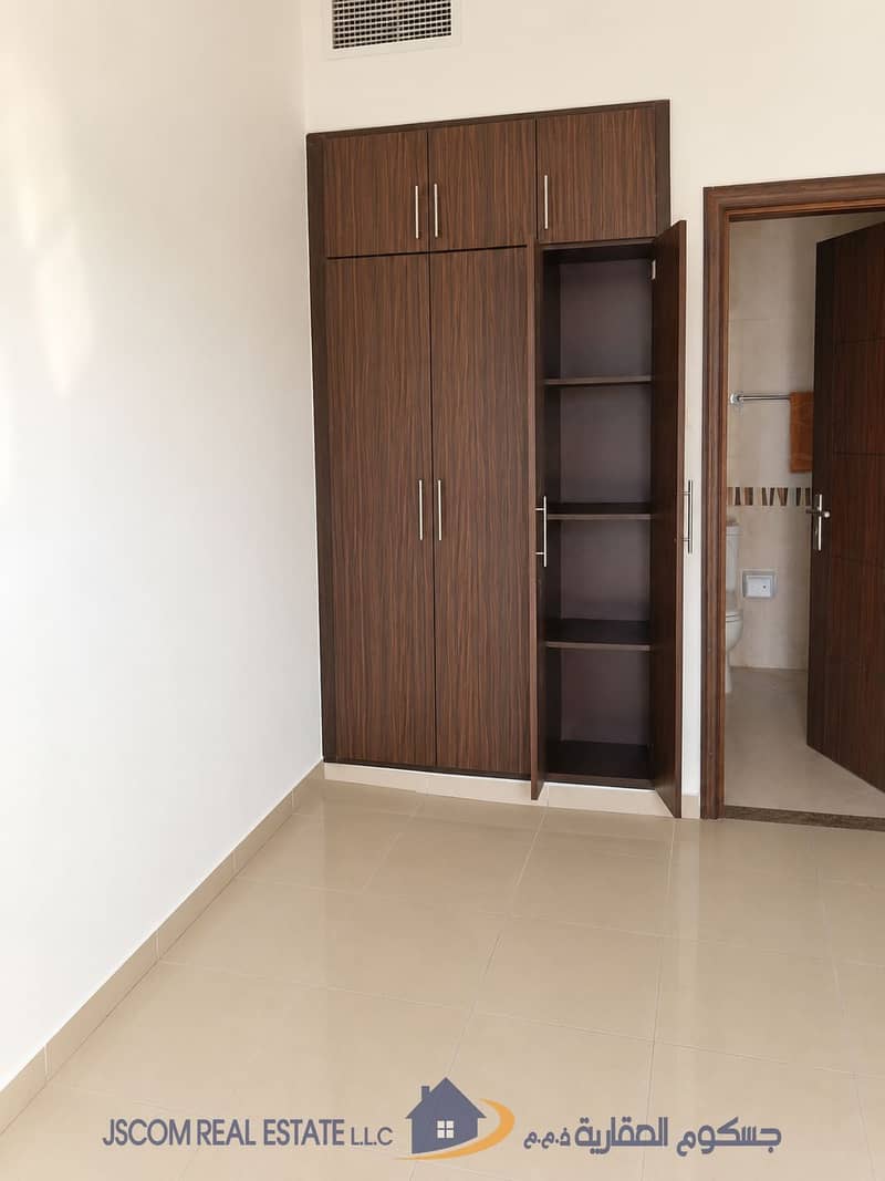 3 Bright Minimalist Room with Open Wardrobe and Bathroom. png