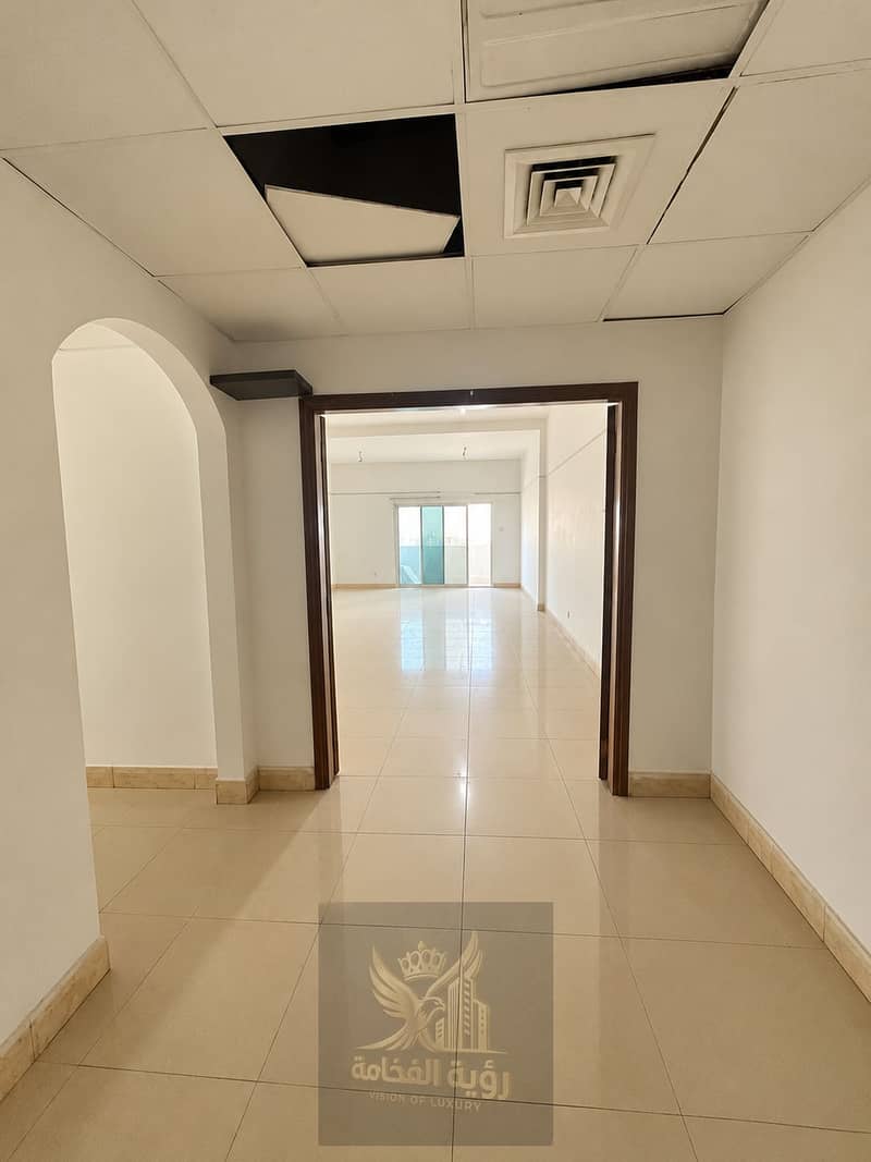 5 Clean Cream-Toned Office Corridor. png