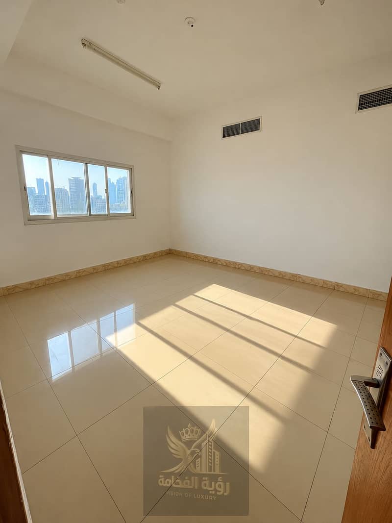 8 Sunlit Empty Room with City Views. png