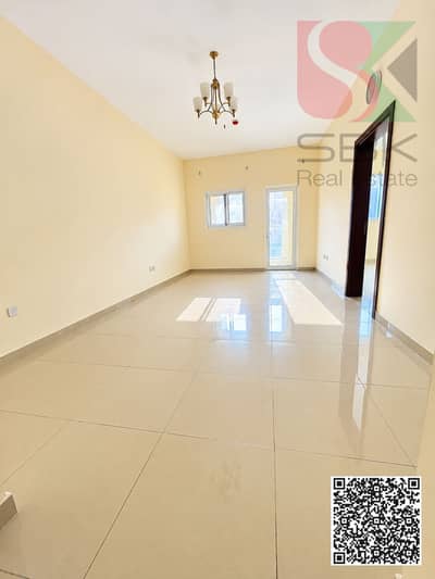 1 Bedroom Flat for Rent in Al Mowaihat, Ajman - Bright Empty Room with Glossy Floors. png 1 Bedroom Flat for Rent in Al Mowaihat, Ajman - Bright Empty Room with Glossy Floors. png