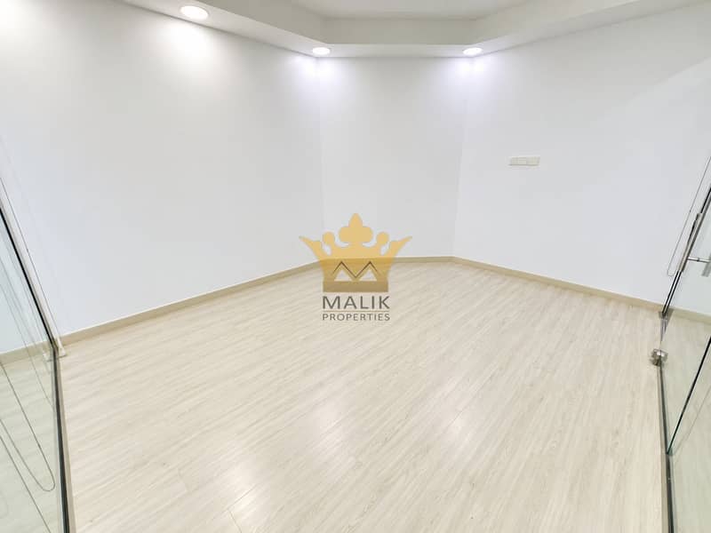 9 Minimalist Empty Glass-Front Office. png