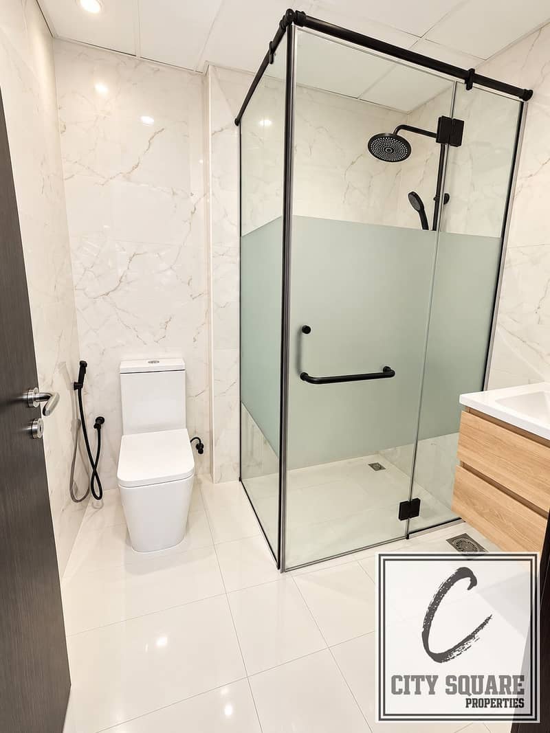 5 Modern Marble Bathroom with Glass Shower. jpeg