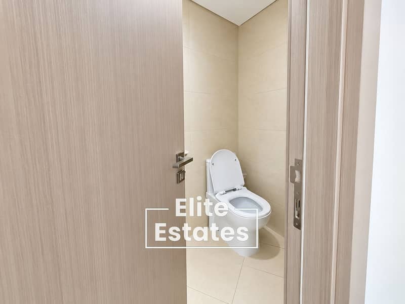 10 Modern Beige Tiled Bathroom Interior. png
