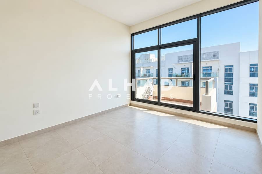 9 Sunlit Modern Room with Balcony Views. png