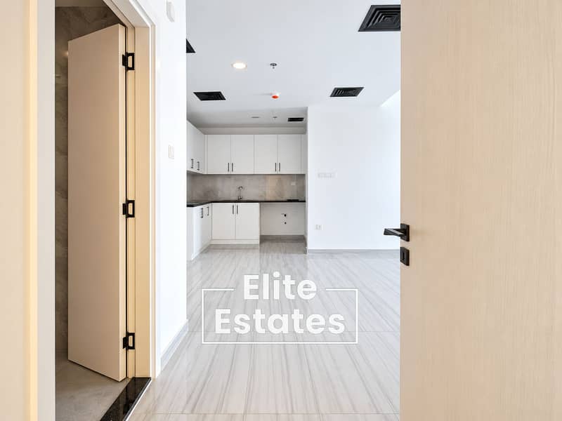 4 Bright Minimalist Apartment Hallway and Kitchen. png