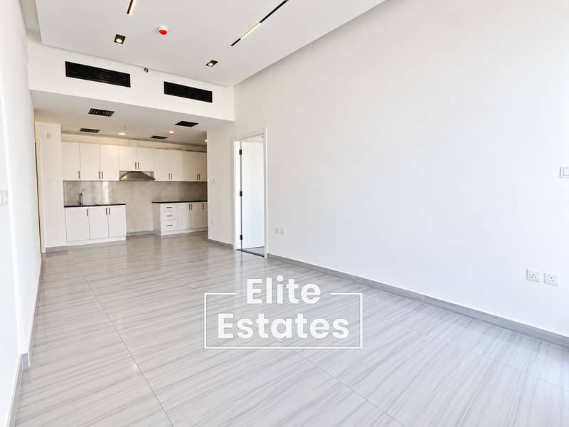 5 Modern Empty Apartment with Open-Plan Kitchen. png