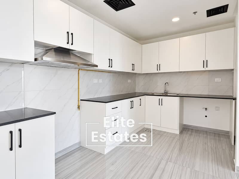 6 Modern L-Shaped Kitchen with Marble Details. png