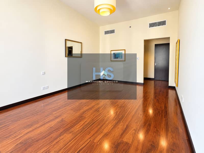 9 Bright Empty Modern Room with Warm Wood Flooring. png