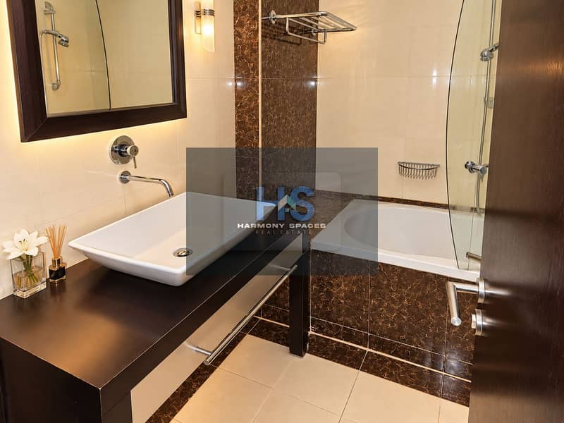 14 Warm Modern Marble Hotel Bathroom. png