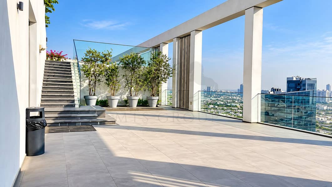 13 Modern Rooftop Terrace with City View. png