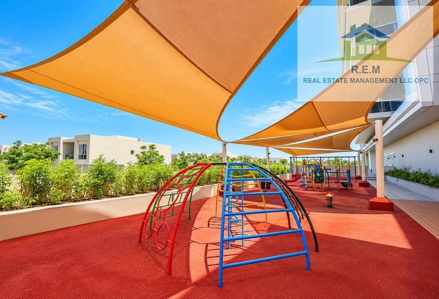 7 Vibrant Modern Playground Under Shade Sails. png