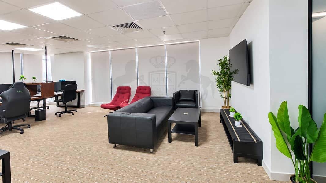 6 Modern Office Lounge with TV and Greenery. png