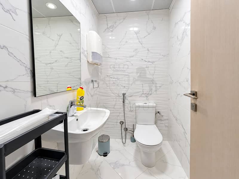 10 Modern Marble-Tiled Restroom. png