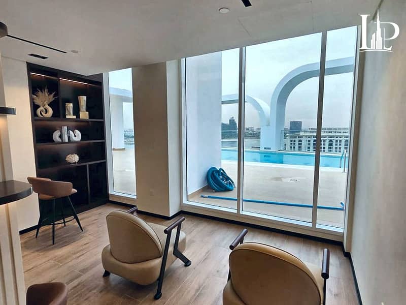 4 11_Residents_Lounge_with_Pool_View. jpg