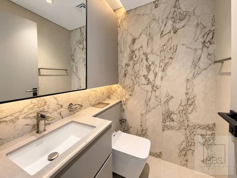 7 Modern Marble Bathroom with Warm Lighting. png