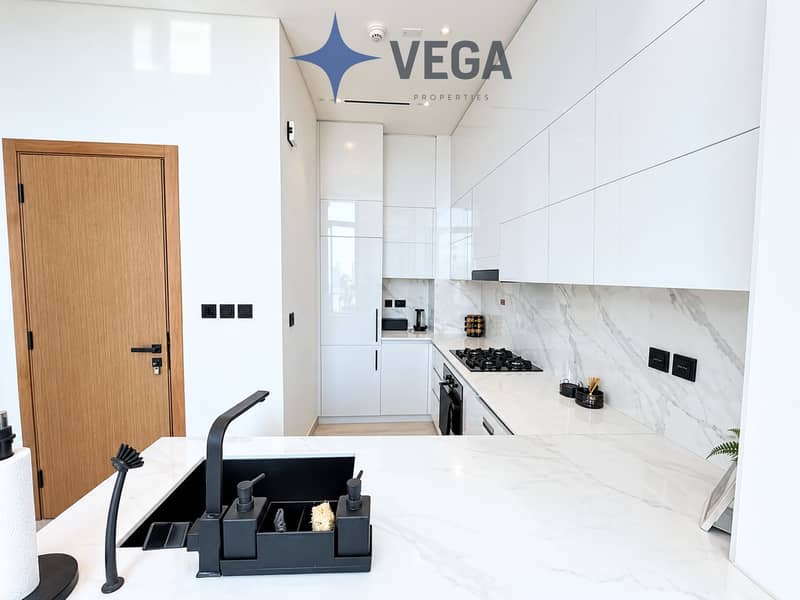 5 Modern White Kitchen with Black Accents. png