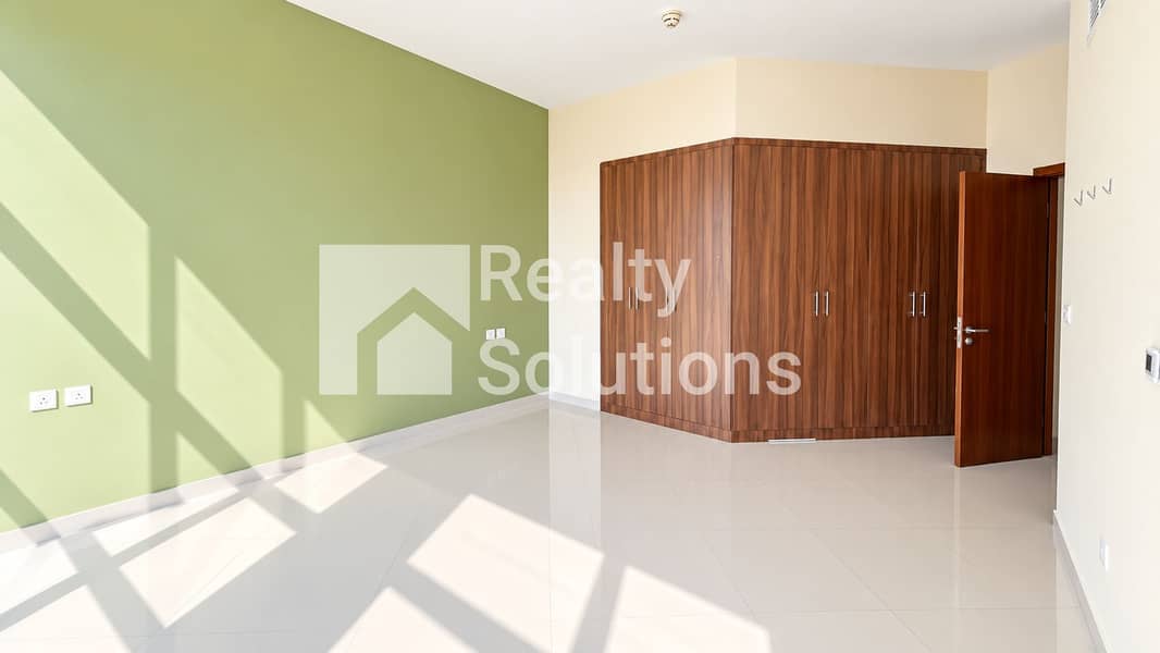 8 Sunlit Sage Bedroom with Walnut Wardrobe. png