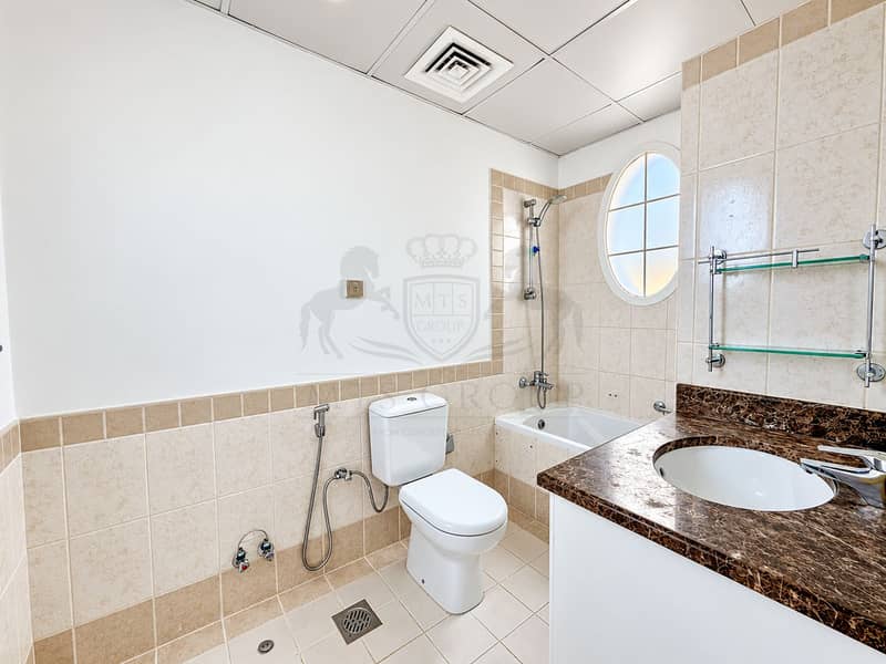 23 Modern Beige-Tiled Bathroom Interior. png