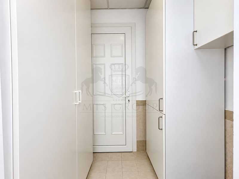 31 Symmetrical White Cabinet Hallway. png
