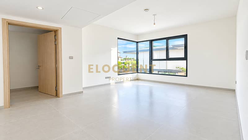 7 Bright Minimalist Room with Corner Windows. png