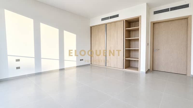 10 Sunlit Minimalist Bedroom with Oak Wardrobe. png